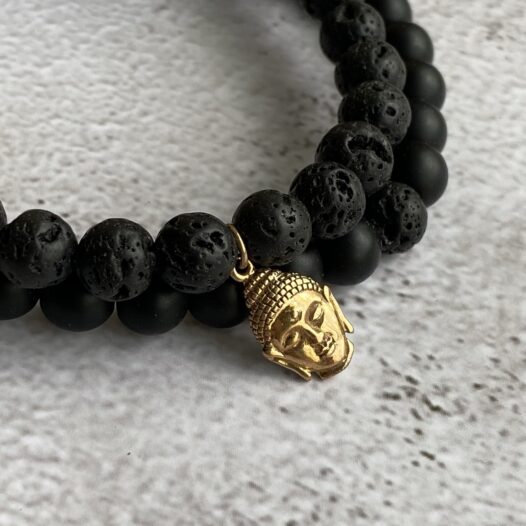 Gold Buddha charm with black stone bracelet
