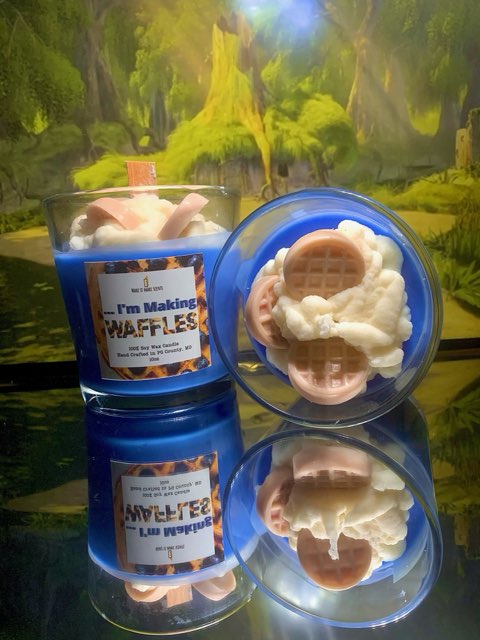 a blue candle with waffles sticking out the top