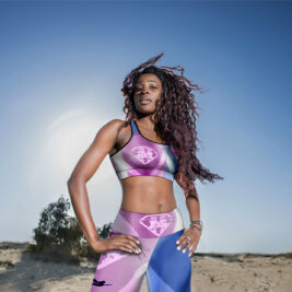 A picture of model wearing our purple and violent crop top and legging.