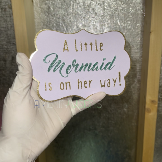 A little mermaid is on her way text. Cake topper.