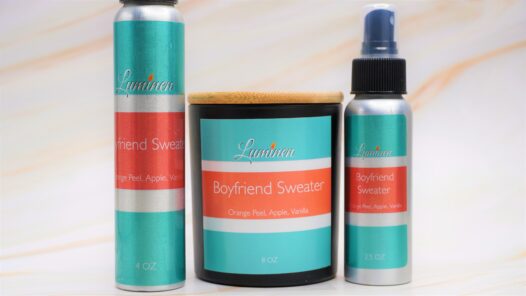 A 2.5 oz and 4 oz aluminum spray bottle labeled boyfriend sweater. a matte black candle jar labeled boyfriend sweater