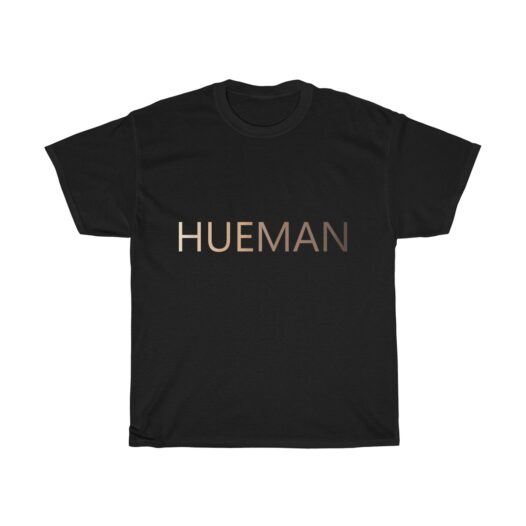 Picture of a black t-shirt with the word Hueman on it that is skin-colored hues from dark skin tones to light skin tones.