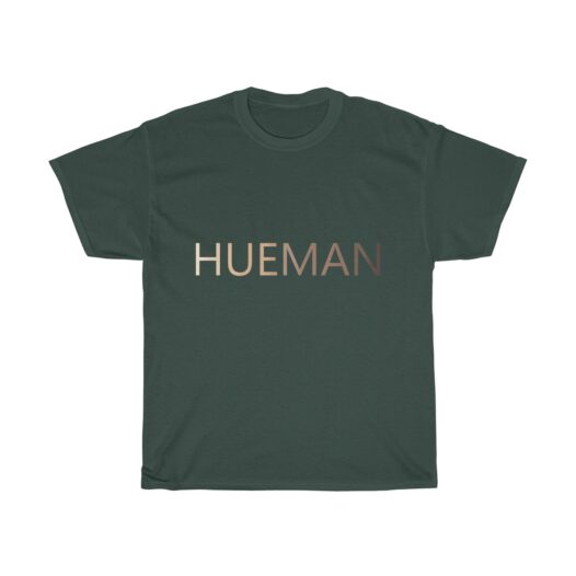 Picture of a forest green t-shirt with the word Hueman on it that is skin-colored hues from dark skin tones to light skin tones.