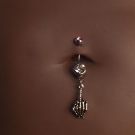 Middle Finger Skull Navel Piercing