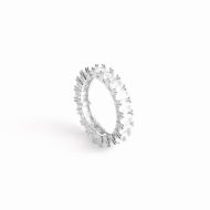 Oval Amor band ring on its side against a white backdrop