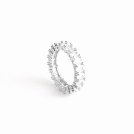 Oval Amor band ring on its side against a white backdrop