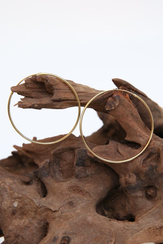 14k Amor Deus Gold Classic Hoop Earrings. Solid hoop with an inset and hinge combination closure for a sleek look.  Medium size
