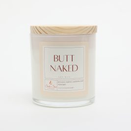 Non-toxic soy candle inside white glass jar with tan wooden lid on top.