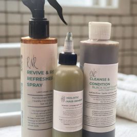 A premium Crown Care Collection set by Niko’s The Natural Boutique, featuring Black Soap Shampoo, Revive & Renew Refresher Spray, Holistic Hair Remedy, and a bonus body butter sample, beautifully styled for natural hair care.