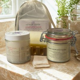 Daily Ritual Bundle by Niko’s – The Natural Boutique, featuring bar soap, body butter, sugar scrub, and a free lip balm, styled as a self-care set for sensitive skin.