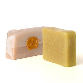 A handcrafted 5oz Even Tone soap bar made with natural ingredients like tamanu oil, kokum butter, aloe, and honey, designed to reduce dark spots and support radiant skin.
