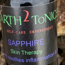 Black glass bottle of earth2tonics Sapphire used for skin therapy
